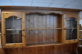 A modern pine dresser having partially glazed back, overall height approx. 202 (base height) 90cm,