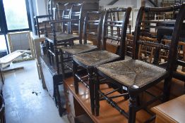 A set of Seven (six plus one) 19th Century rush seated chairs having bobbin turned backs and