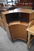 A mid 20th Century walnut corner unit