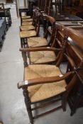 A set of eight (six plus two) 19th Century rush seated chairs having turned rail and front stretcher