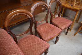 A Victorian mahogany chaise longue and six similar balloon back dining chairs, stamped to