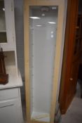 A modern glazed lightwood effect display case, of oblong form with adjustable glass shelving 170cm x