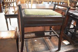 An early 20th Century stained frame piano stool