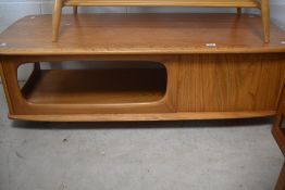 An Ercol light elm rectangular Pandora's box coffee table, 40cm x 122cm x 52cm