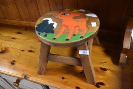 A Childs stool having Christmas theme, width approx. 25cm