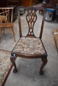 A set of four (three plus one) Chippendale revival style mahogany dining chairs having ball and claw