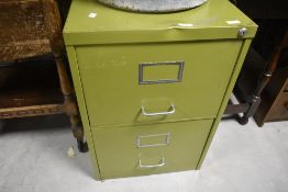 A vintage green painted metal two drawer filing cabinet, 70cm x 47cm x 62cm knock to front edge