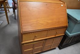 A 1970's Nathen teak bureau, of traditional for and design, 104cm x 84cm x 45cm