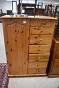 A yellow pine childs wardrobe with drawer section, height approx. 129cm
