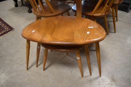 An Ercol 'pebble' nest of three tables (some surface wear) , width approx. 65cm