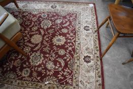 A modern machine made rug of Europeanised Ziegler/Persian design 248cm x 168cm
