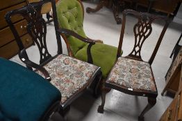 A reproduction mahogany Georgian style carver chair, with pierced interlaced splat back and out-