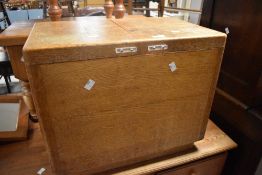 A vintage golden oak work box having double lift lid, dimensions approx. 56 x 36 x 46cm