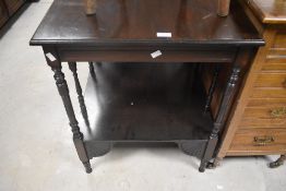 An Edwardian mahogany occasional table, of square section, with carved 'fan' detail and brackets