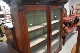 A Victorian mahogany full height secretaire bookcase having glazed upper section, desk section and