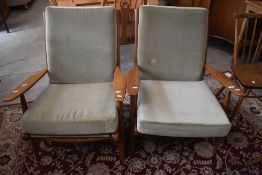 A pair of 1960's/70's design Scandart elm easy armchairs, seat heights without cushion 34cm