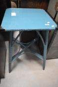 A 1950's blue painted Lloyd Loom type woven-wicker occasional table 69cm x 46cm