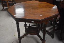 A Victorian mahogany occasional table having octagonal top and galleried undertier, diameter approx.