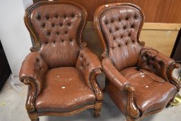 A pair of Victorian style mahogany framed armchairs having buttoned leather backs