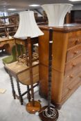 Two turned mahogany standard lamps