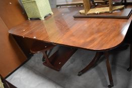 An interesting 19th Century twin pedestal dining table , having Regency supports, associated top