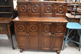 An interesting pine mid 20th Century court cupboard style sideboard , having dark stained , width