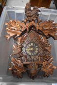 A vintage cuckoo clock having owl figural decoration