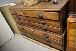A traditional six drawer plan chest, mounted on transport base, width approx. 120cm