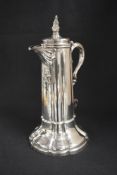 An impressive silver plated presentation flagon, the decorative pointed finial over a lobed lid with