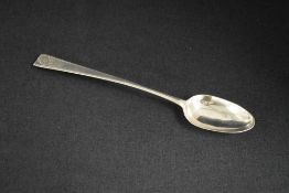 A large George II Irish silver basting spoon, having feather thread decoration and scroll