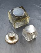 An Edwardian Scottish silver mounted glass inkwell of square form having a heraldic crest