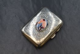 A George V silver cigarette case, of hinged rectangular form having scroll decoration and an
