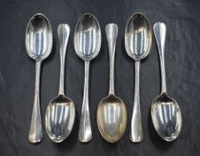 A set of six Edwardian silver Hanoverian rat-tail pattern dessert spoons, having 'DJJ' monogram to