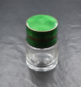A George V silver and guilloche enamel mounted glass vanity bottle, of circular form having a silver