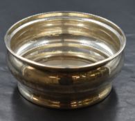 An Elizabeth II silver sugar bowl, of circular form having a moulded rim and bulbous body, marks for