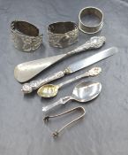An assortment of silver and silver mounted items, including two thistle motif napkin rings, a silver