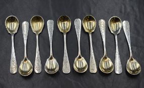 A group of ten white metal 800. grade condiment spoons, having floral decoration and 'B' initial
