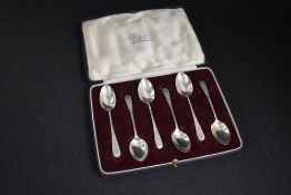 A cased set of Victorian silver teaspoons, having decorative floral engraving with vacant