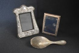 An Elizabeth II silver mounted photograph frame, of Art Nouveau style having a central dragonfly,