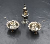 A pair of Victorian silver salts, of circular form having crimped rims raised on three ball feet,