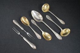 A group of five 19th century German white metal 800. grade spoons, comprising a serving spoon, two