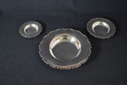 A set of three Elizabeth II silver graduated Armada dishes, having Chippendale dale style rims,