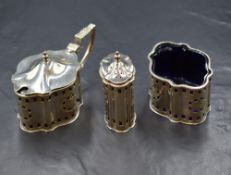 An Elizabeth II silver three-piece cruet set, comprising salt, mustard and pepper, of lobed oval