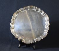 A George V silver salver, of circular form having a Chippendale style rim, marks for Sheffield 1924,