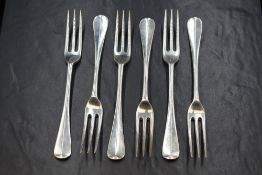 A set of six Edwardian silver Hanoverian pattern dessert forks, having 'DJJ' monogram to terminal