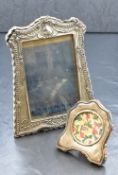 A George V silver mounted photograph frame, of rectangular form having gadrooned scroll borders