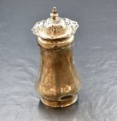 An Elizabeth II silver sugar caster, of bulbous form having a pointed finial over a pieced top