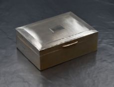 An Elizabeth II silver cigarette box, of hinged rectangular form having engine turned decoration and