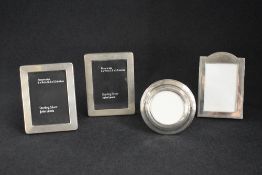 An Edwardian silver mounted wooden photograph frame, of circular form having step engraving, 9cm,