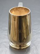 A George VI silver tankard, of bulbous form having a generous S-curve handle and 'PBA' engraved to
